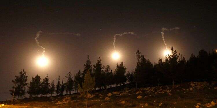 IDF flares light up the sky over the Israel-Lebanon border Report: Israeli airstrikes hit Hezbollah, Iranian targets in Syria