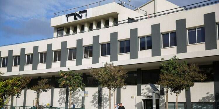 Haaretz accused of maligning Haredim in COVID cartoon