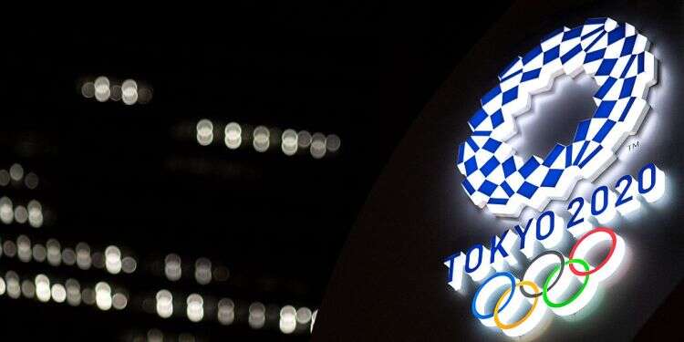 The Tokyo 2020 Olympic Games logo is pictured outside the Tokyo station, June 22, 2021 Citing COVID emergency, Japan bans fans from Tokyo Olympics