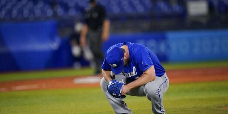 Israel's Jeremy Bleich reacts after hitting two South Korea batters in a row in the tenth inning of a baseball game at the 2020 Summer Olympics, July 29, 2021 Israel loses to S. Korea in heartbreaking fashion in Olympic baseball