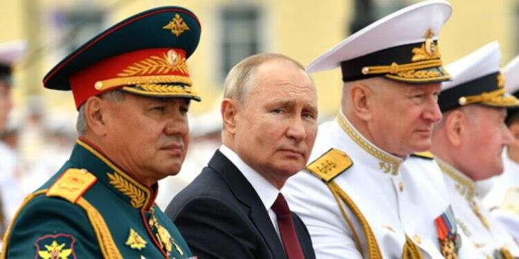 Commander-in-Chief of the Russian Navy Admiral Nikolai Yevmenov, Russian President Vladimir Putin, and Russian Defense Minister Sergei Shoigu watch the Navy Day parade in St.Petersburg, July 25, 2021