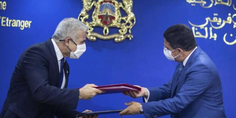 Morocco hails Israel ties during Lapid's visit, urges peace with Palestinians