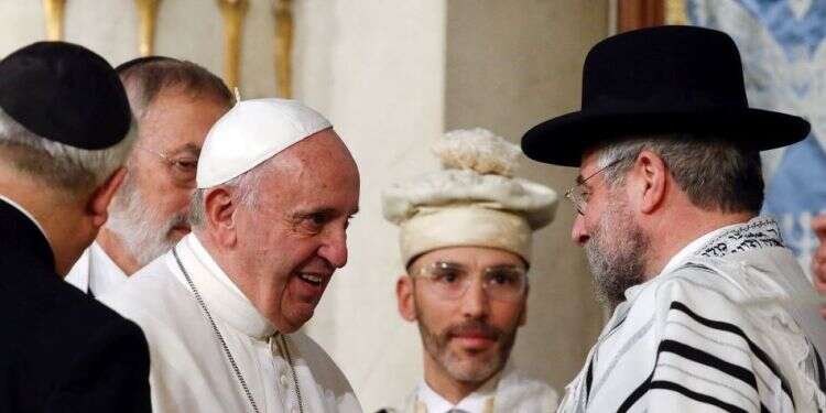 Pope Francis is greeted as he arrives at Rome's Great Synagogue, Jan. 17, 2016 Rabbis troubled by pope's remarks questioning Torah's validity
