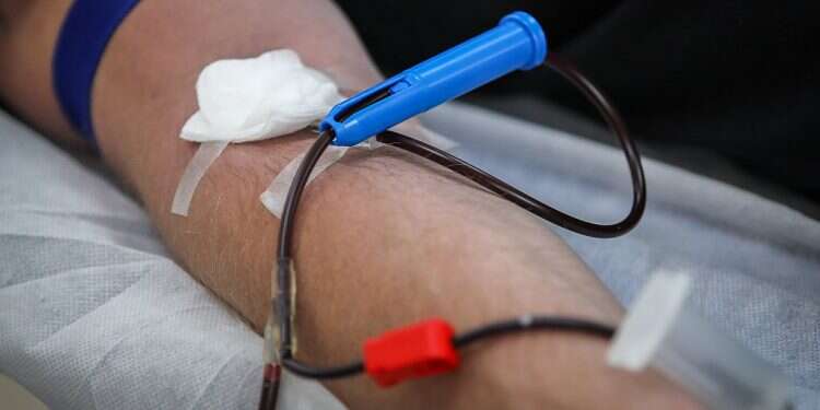 An unidentified man donates blood on May 3, 2020 Israel lifts restriction on gay men donating blood