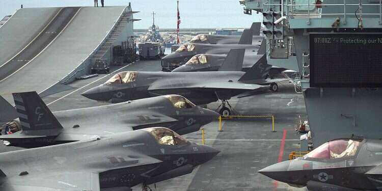 US Marine combat jets parked near the take-off ramp aboard the deck of the Royal Navy's HMS Queen Elizabeth aircraft carrier in the port of Cyprus' southern city of Limassol, July 1, 2021 Report: UK gearing up for military response over alleged Iranian attack on MV Mercer Street