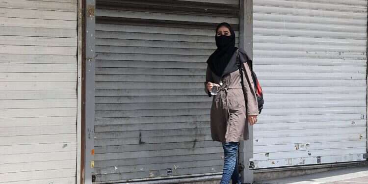 Iran's COVID surge leads to shutdown, travel ban