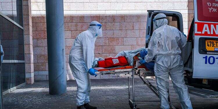 'We're at war; next 2 weeks critical,' coronavirus chief warns