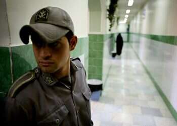 A prison guard in Tehran's Evin prison Iran sentences German human rights activist to 10 years in jail