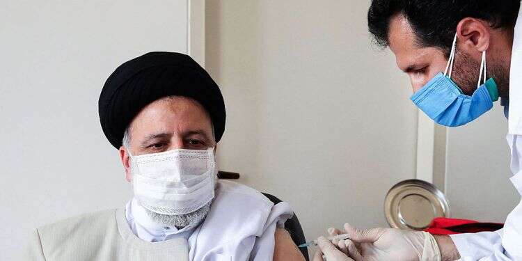 Iranian President Ebrahim Raisi receives a dose of the domestically produced COVIran Barekat coronavirus vaccine
Iran's COVID rate means 'death every 2 minutes'