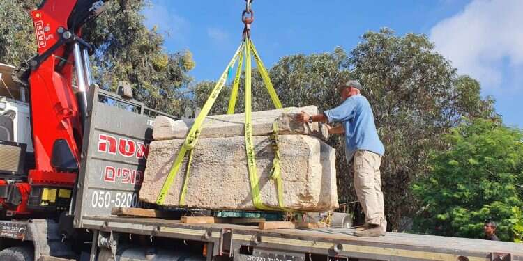 The Roman-era sarcophagus is lifted onto a truck for transport 'Hand over that sarcophagus, citizen!'