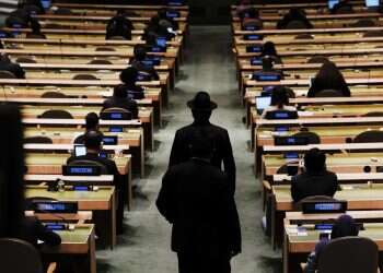 Delegates walk into the annual gathering for the 76th session of the United Nations General Assembly, Sept. 21, 2021 'United' Nations struggles to navigate fractured world