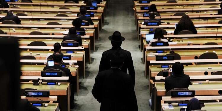 Delegates walk into the annual gathering for the 76th session of the United Nations General Assembly, Sept. 21, 2021 'United' Nations struggles to navigate fractured world