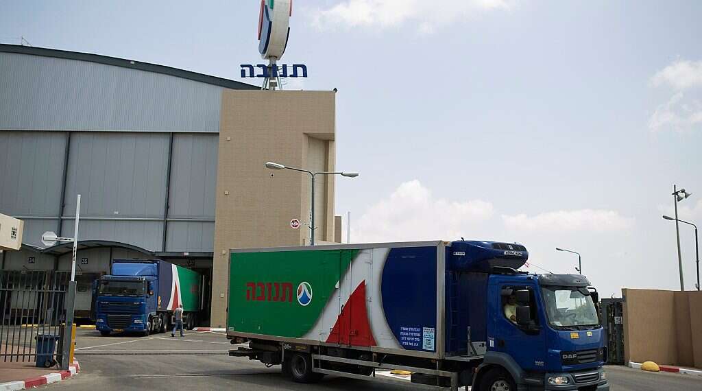 A Tnuva truck leaves the company's logistic centre in the southern Israel Israel's Tnuva to help Emirates Food Industries expand dairy products