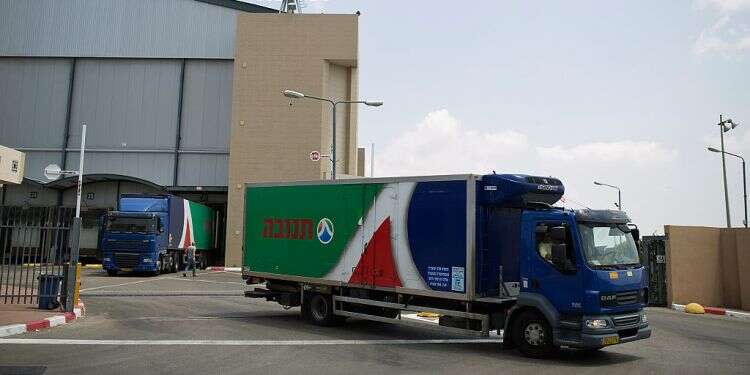 A Tnuva truck leaves the company's logistic centre in the southern Israel Israel's Tnuva to help Emirates Food Industries expand dairy products