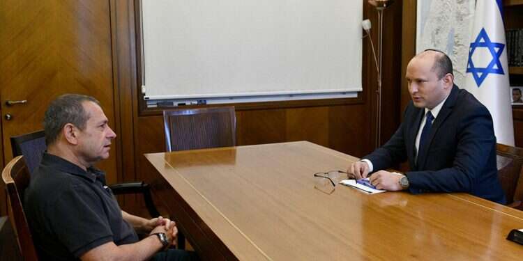 Prime Minister Naftali Bennett with outgoing Shin Bet director Nadav Argaman PM taps deputy director to lead Shin Bet, calls him 'courageous fighter'