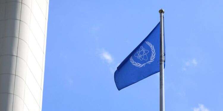 The International Atomic Energy Agency flag waves at the entrance of the Vienna International Center in Vienna, Austria, June 7, 2021 Iranian guards sexually harassed IAEA inspectors at Natanz nuclear research center