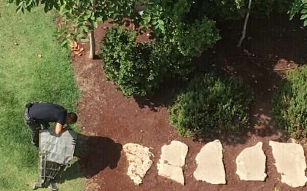 An Israel Police officer inspects a fragment of the Syrian anti-aircraft missile fired toward Israel overnight Thursday Fragments of Syrian missile located in Tel Aviv