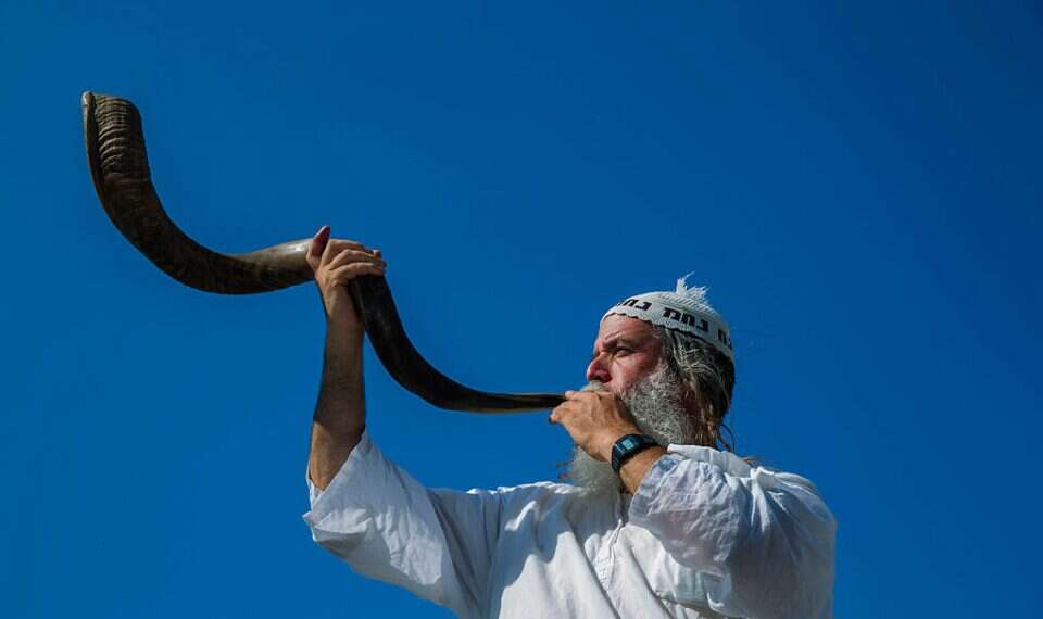 Breslov Chassid blowing a shofar eBay reports record-breaking shofar sales ahead of Rosh Hashanah