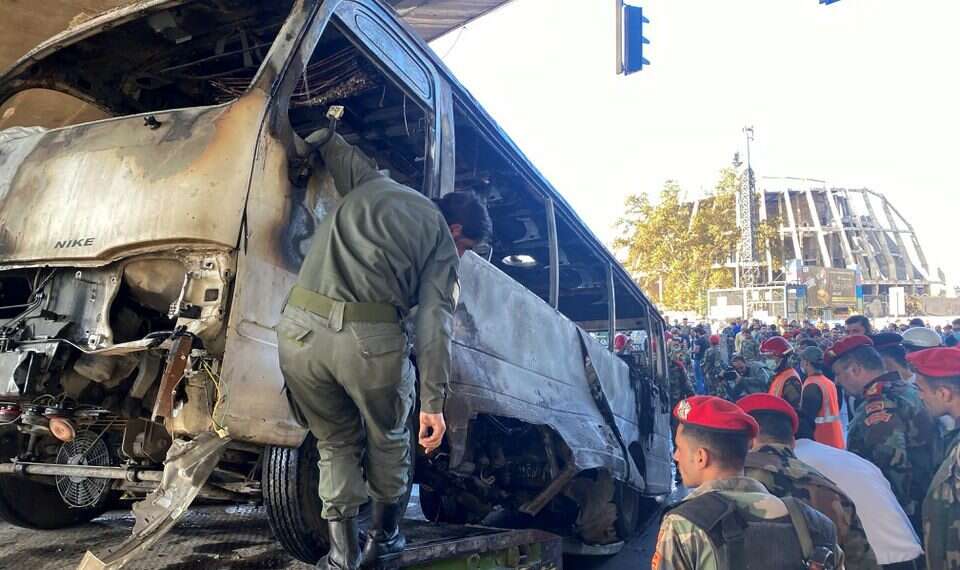 Syrian security forces inspect the site of an explosion in central Damascus, Syria October 20, 2021 At least 14 Iranian officers killed in Damascus bus blast