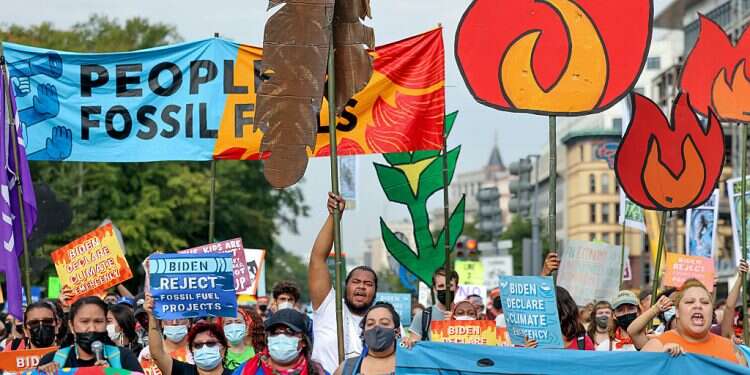 Environmental activists march to the US Capitol on October 15, 2021 Greenhouse gas emissions reach record high, UN says