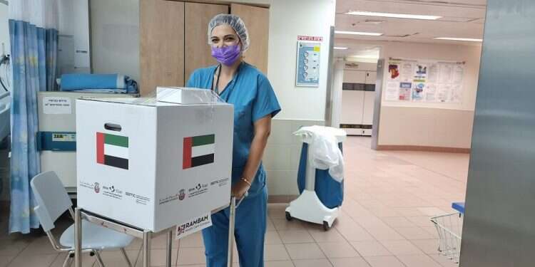 A medical worker at Rambam Medical Campus in Haifa wheels out a donated kidney destined for transplant in the United Arab Emirates, Oct. 4, 2021 Middle East 'kidney diplomacy' saves 3 women's lives