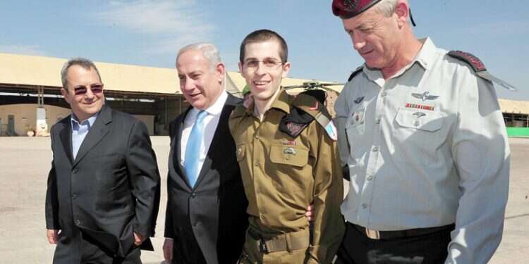 Former prime ministers Ehud Barak and Benjamin Netanyahu and then-IDF Chief of Staff Benny Gantz greet Gilad Schalit upon his release from Hamas captivity A question of cost