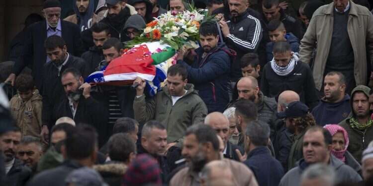 Palestinians carry the body of Isra Khazimia during her funeral in the West Bank village of Qabatiya, Nov. 20, 2021 Israel returns Palestinian remains after mix up of bodies