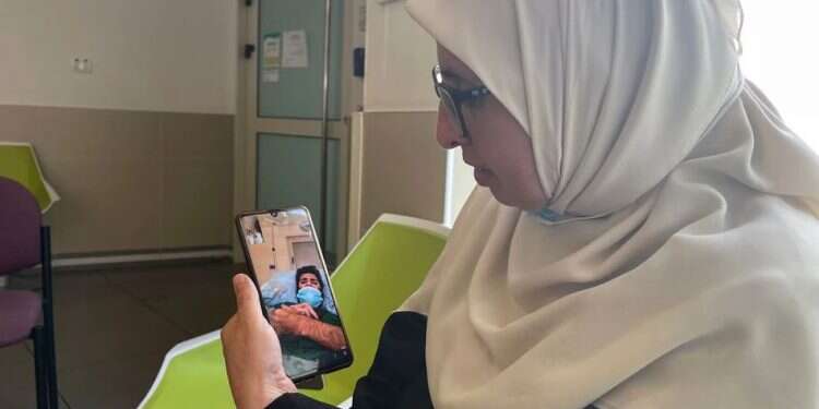 Mother of Palestinian prisoner Miqdad al-Qawasmi at the Kaplan hospital, in Rehovot, Nov. 4, 2021 Palestinians demand Israel release prisoner on 112-day hunger strike