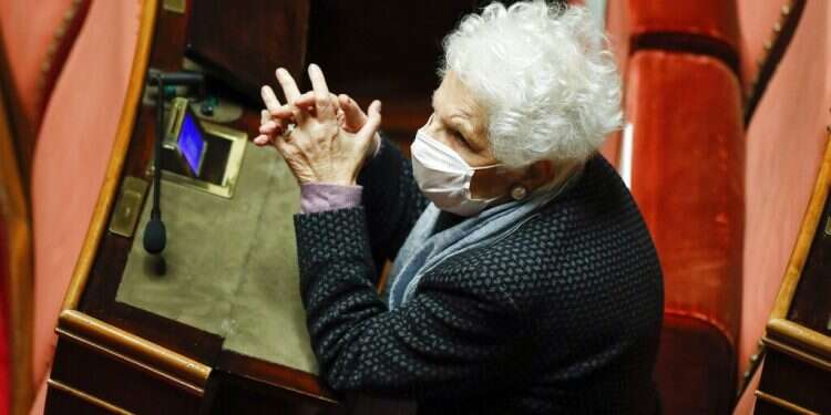 Holocaust survivor Liliana Segre wears a face mask to curb the spread of COVD-19 as attends the debate at the Senate prior to a confidence vote, in Rome, Jan. 19, 2021 Outcry in Italy after politician calls Holocaust survivor by Auschwitz number