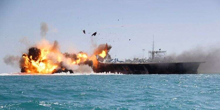 A replica of a US aircraft carrier explodes after being hit by IRGC fire as part of a large-scale naval drill in the Persian Gulf, Feb. 27, 2015
Iran launches massive maritime war games in Gulf of Oman, Red Sea
