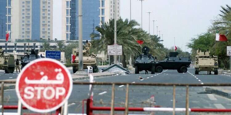 Armoured vehicles belonging to Gulf Cooperation Council (GCC) military forces guard the entrance to Pearl Square in Manama March 17, 2011 Bahrain arrests group 'linked with terrorist groups in Iran,' says attack foiled