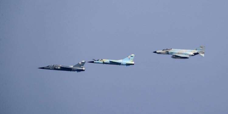 Fighter jets participate in the closing parade of an Iranian military exercise dubbed 'Zulfiqar 1400,' in the Gulf of Oman, Iran, Nov. 7, 2021 Iran says it warned off US drones approaching Gulf military drill