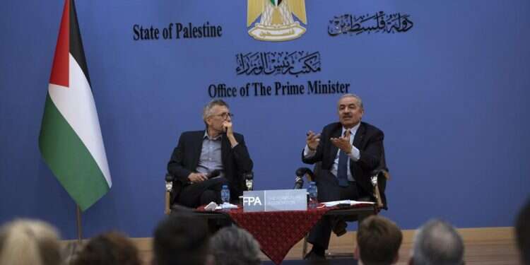 PA Minister Mohammad Shtayyeh, right, holds a briefing with foreign press alongside Andrew Carey, chairman of the Foreign Press Association, in Ramallah, Wednesday, Nov. 10, 2021 Palestinians: US does not need Israel's 'permission' to open consulate in Jerusalem