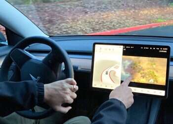 Tesla to block games on infotainment screens while cars are in motion