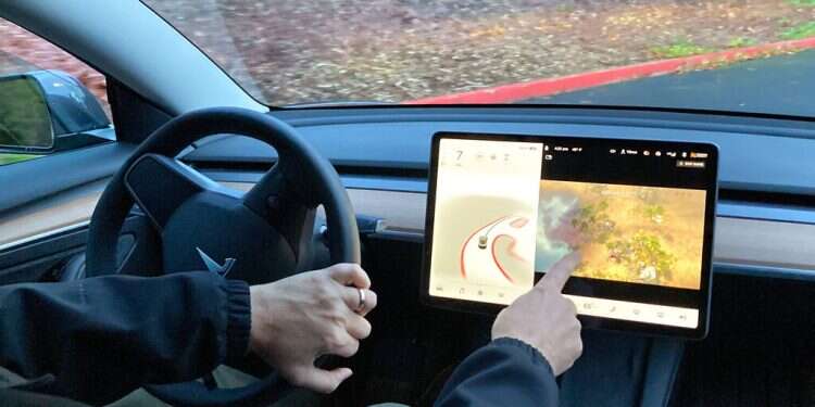 Tesla to block games on infotainment screens while cars are in motion