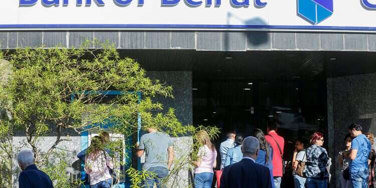 People queue outside a branch of Bank of Beirut, Nov. 1, 2019 UN chief: 'Ponzi scheme' crashed Lebanon's finances