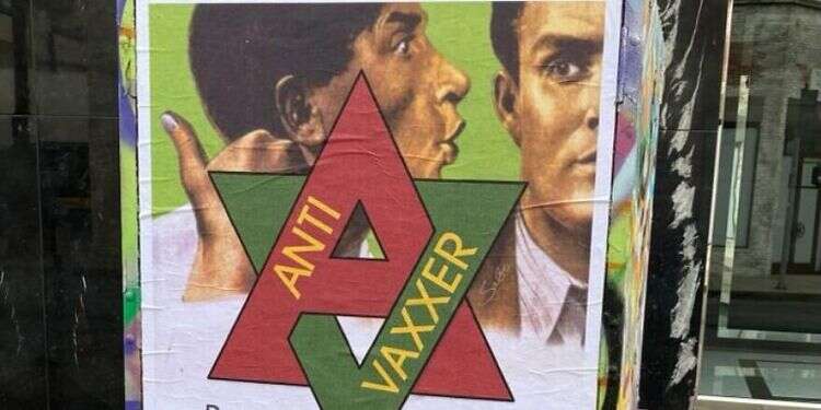 Anti-vaccine posters take clear antisemitic turn in Los Angeles