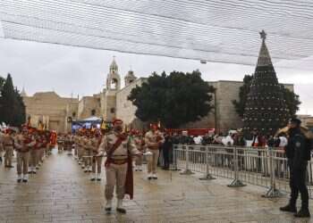 COVID, rainy weather dampen Bethlehem Christmas festivities