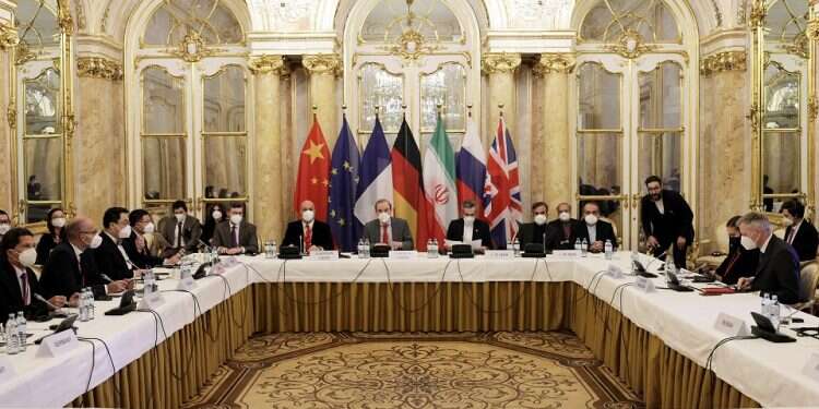 Delegation members wait for the start of a meeting of the JCPOA Joint Commission in Vienna, Austria, Dec. 17, 2021 Iran, world powers convene for 8th round of nuclear talks