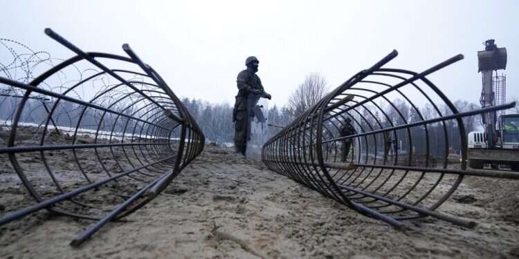 Poland building metal wall on Belarus border 