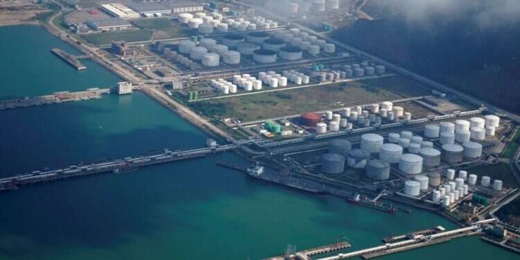 Oil and gas tanks are seen at an oil warehouse at a port in Zhuhai, China October 22, 2018
China reports first official Iranian oil imports since December 2020