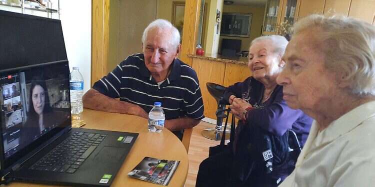 Holocaust survivors watch a commemorative ceremony via Zoom Over 15,000 Holocaust survivors passed away last year
