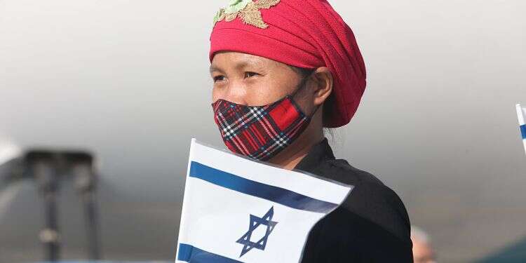 A new immigrant is seen upon landing at Ben-Gurion International Airport in Tel Aviv, Oct. 13, 2021 New aliyah initiative will discourage immigration to Israel, critics warn