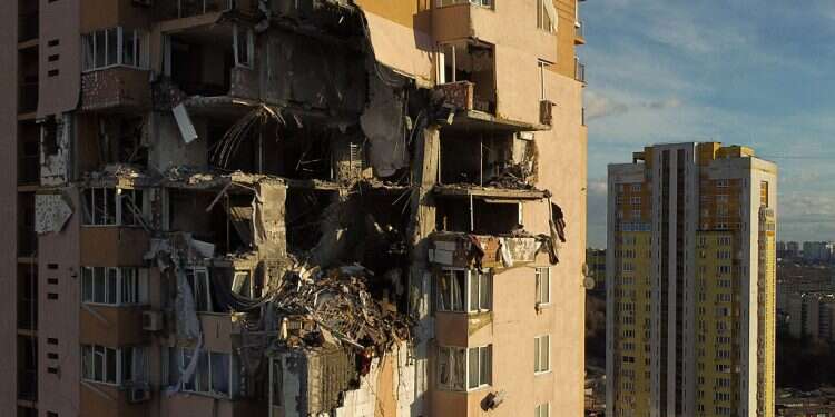 This general view shows damage to the upper floors of a building in Kyiv on Feb. 26, 2022, after it was reportedly struck by a Russian rocket Bennett: Israel to send 100 tons of humanitarian aid to Ukraine