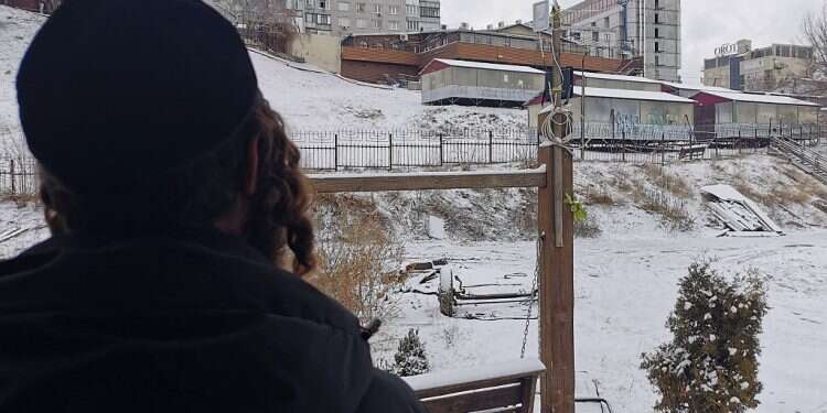 Few Jews remaining in Uman pray, await 'apocalypse'