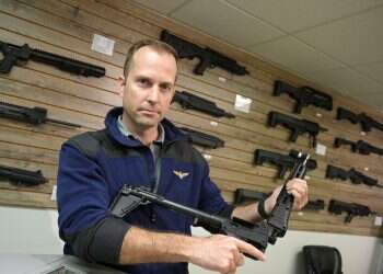Adrian Kellgren, director of industrial production of KelTec, holds a 9mm SUB2000 rifle, similar to ones his company is shipping to Ukraine, at their manufacturing facility in Cocoa, Florida, March 17, 2022 Americans collecting guns to arm Ukrainians in Russia war