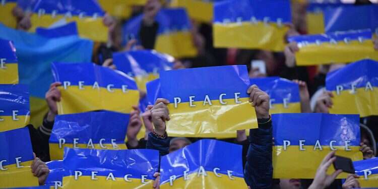 Fans display the Ukraine flag inside the stadium before a match between AC Milan and Inter Milan in San Siro, March 1, 2022 Ukraine's tech diaspora races to mobilize Silicon Valley in war with Russia