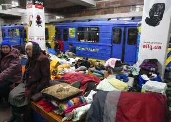 People with their belongings hide in a city subway that they have used as a bomb shelter for over three weeks in Kharkiv, Ukraine, on March 24, 2022 Ukrainians report 4 dead after Russian shells hit aid center east of Kharkiv