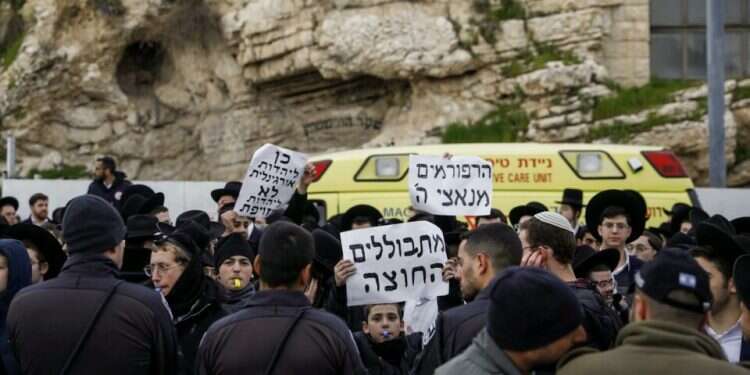 Haredi protesters are seen at the Western Wall in Jerusalem's Old City, March 4, 2022 Haredim clash with Reform, Conservative Jews at Western Wall