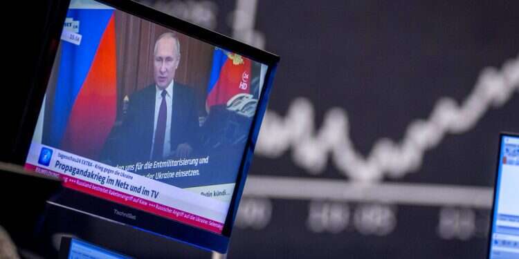 Russian President Vladimir Putin appears on a television screen at the stock market in Frankfurt, Germany, on Feb. 25, 2022
US, Ukraine team up to wage war on Putin's propaganda